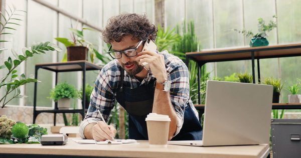 Small business owner using devices